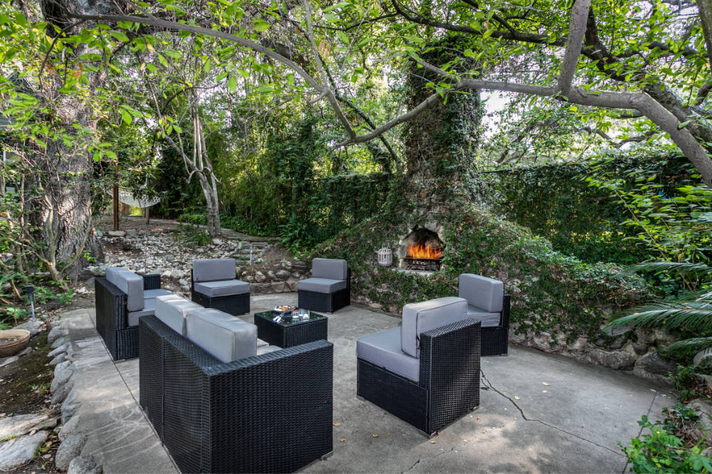 Patio and furniture with fireplace