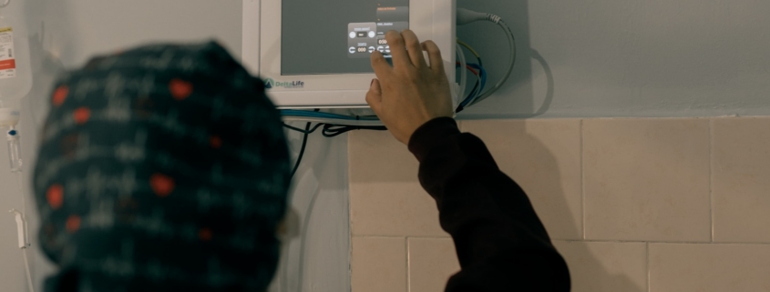 Medically monitored opioid detox in residential treatment: nurse adjusting a vital signs monitor during 24/7 withdrawal management