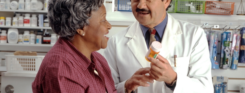 pharmacist explaining a naltrexone prescription to a patient in a residential treatment program