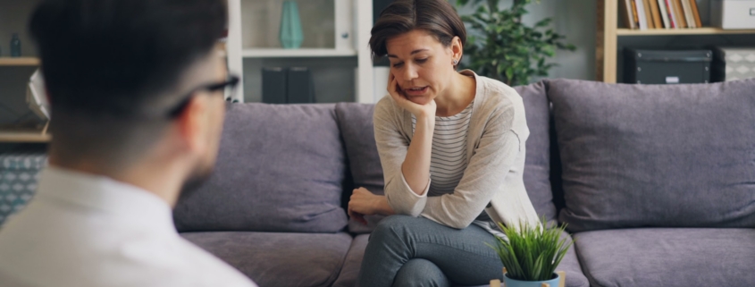 therapist meeting with a client to discuss treating OCD and addiction together