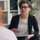 therapist talking with a client during treatment for anxiety and alcohol use disorder