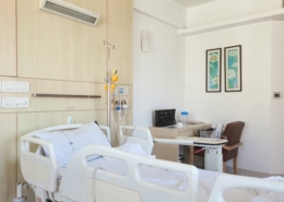 private inpatient treatment room with a hospital bed and IV pole