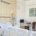 private inpatient treatment room with a hospital bed and IV pole