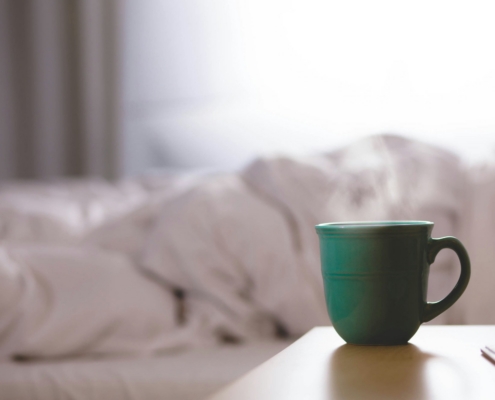 Calm morning mug on a wooden surface representing the steadier days after medical alcohol detox