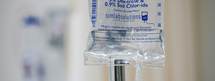 IV drip stand in a hospital room representing medical detox care