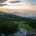 Sunrise over a mountain path, symbolizing hope and a new beginning in recovery from opioid use disorder