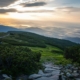 Sunrise over a mountain path, symbolizing hope and a new beginning in recovery from opioid use disorder