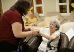 Caregiver assisting an older adult during medical detox care