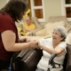 Caregiver assisting an older adult during medical detox care