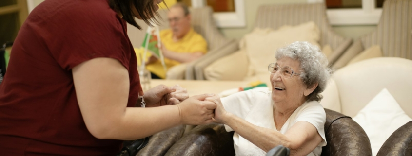 Caregiver assisting an older adult during medical detox care