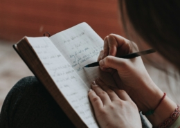 Person journaling during post-acute withdrawal recovery reflection