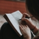 Person journaling during post-acute withdrawal recovery reflection