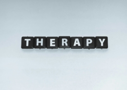 Two people talking in a supportive counselling setting