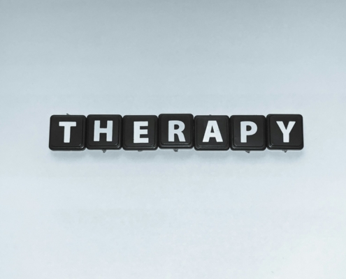 Two people talking in a supportive counselling setting