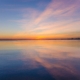 Residential dual diagnosis treatment vs psychiatric hospital care, calm sunrise over still water symbolizing stabilization in Los Angeles residential treatment