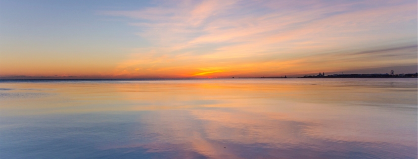 Residential dual diagnosis treatment vs psychiatric hospital care, calm sunrise over still water symbolizing stabilization in Los Angeles residential treatment