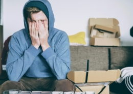 signs of high-functioning alcoholism before residential treatment — thoughtful professional at office window