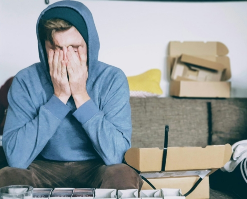signs of high-functioning alcoholism before residential treatment — thoughtful professional at office window