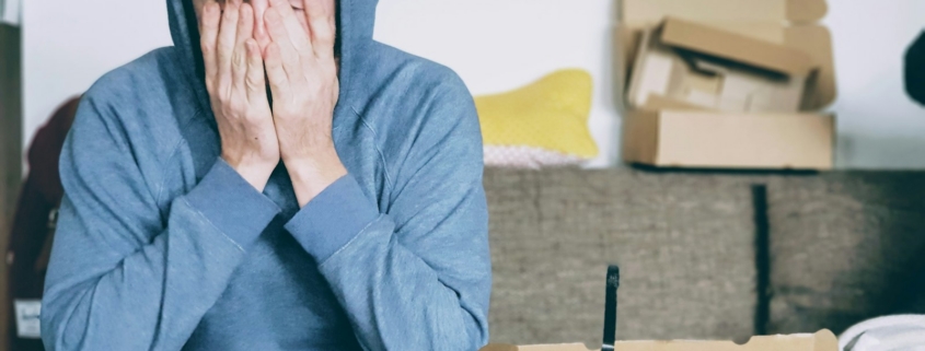 signs of high-functioning alcoholism before residential treatment — thoughtful professional at office window