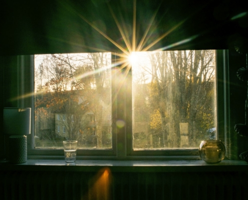 Quiet morning light through a window, representing the moment a family recognizes that outpatient addiction care is no longer enough