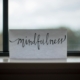 Person in a calm therapy office reflecting during a trauma-informed addiction recovery session